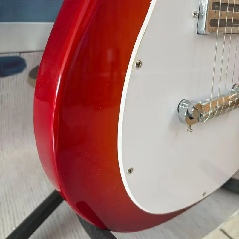 Red electric guitar with white pickguard