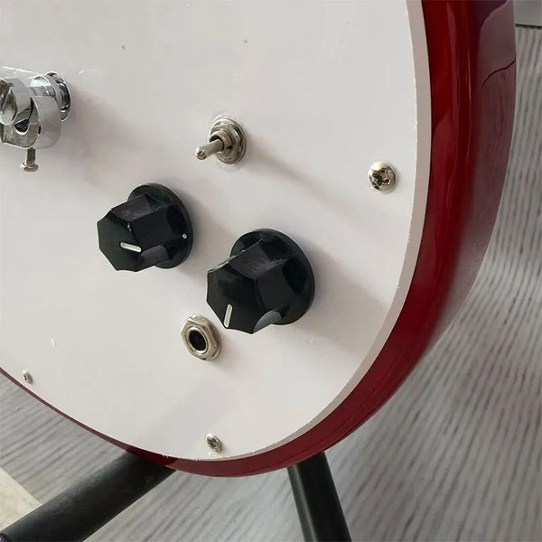 Red electric guitar with white pickguard