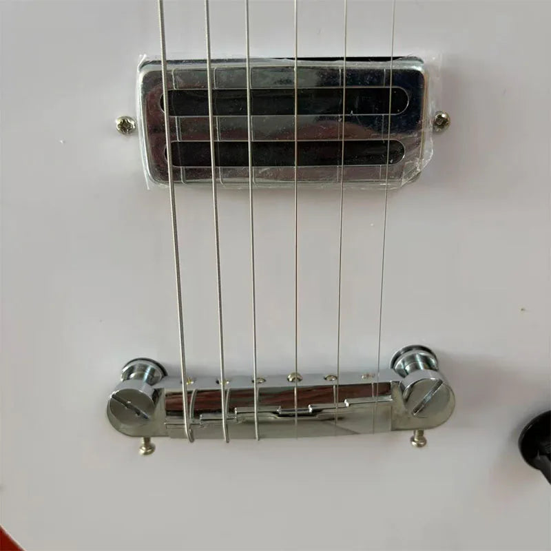 Red electric guitar with white pickguard